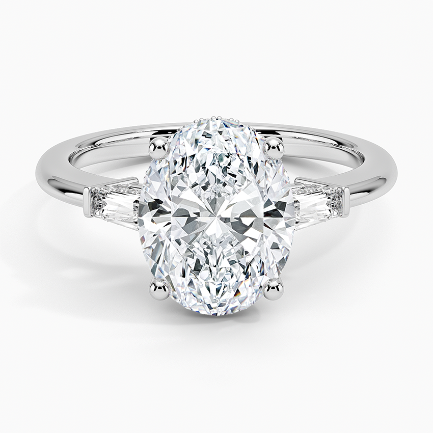 Adorned Tapered Baguette Three Stone Diamond Ring Platinum Oval Engagement Ring
